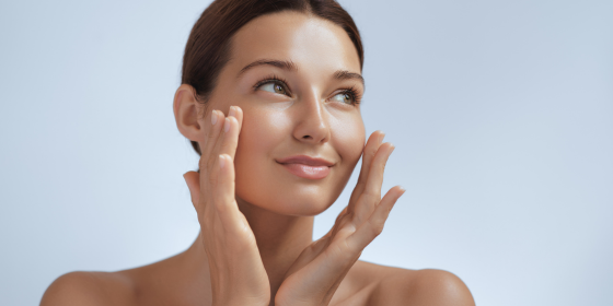 woman enjoying face cream