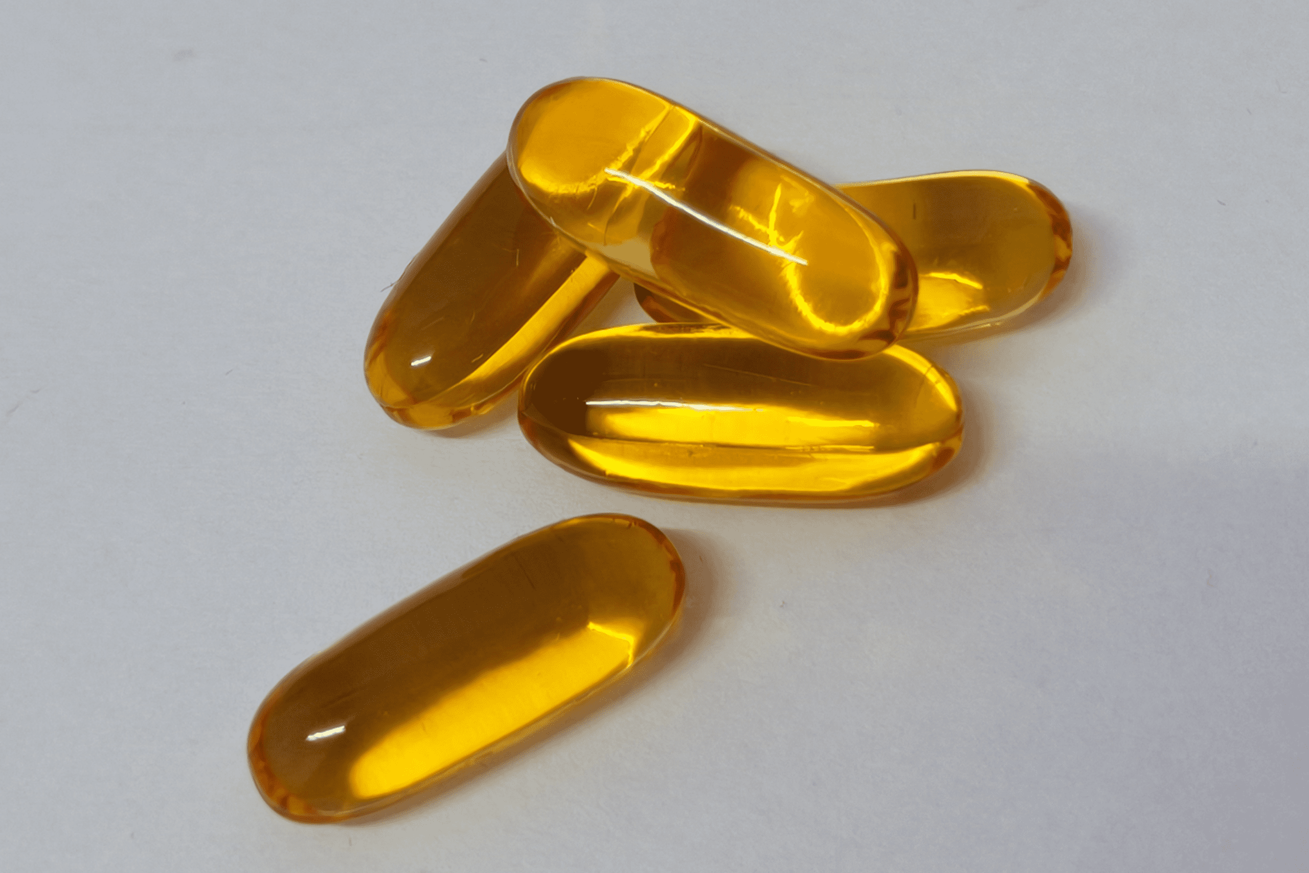 5 pharmaceuticals pills on with a grey background